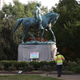 A homemade sign that reads, “Heather Heyer Park,” rests at the base of the statue of Confederate Gen. Robert E. Lee that stands in the center of Emancipation Park on Aug. 18, 2017, in Charlottesville, Va. ( Mark Wilson/Getty Images)